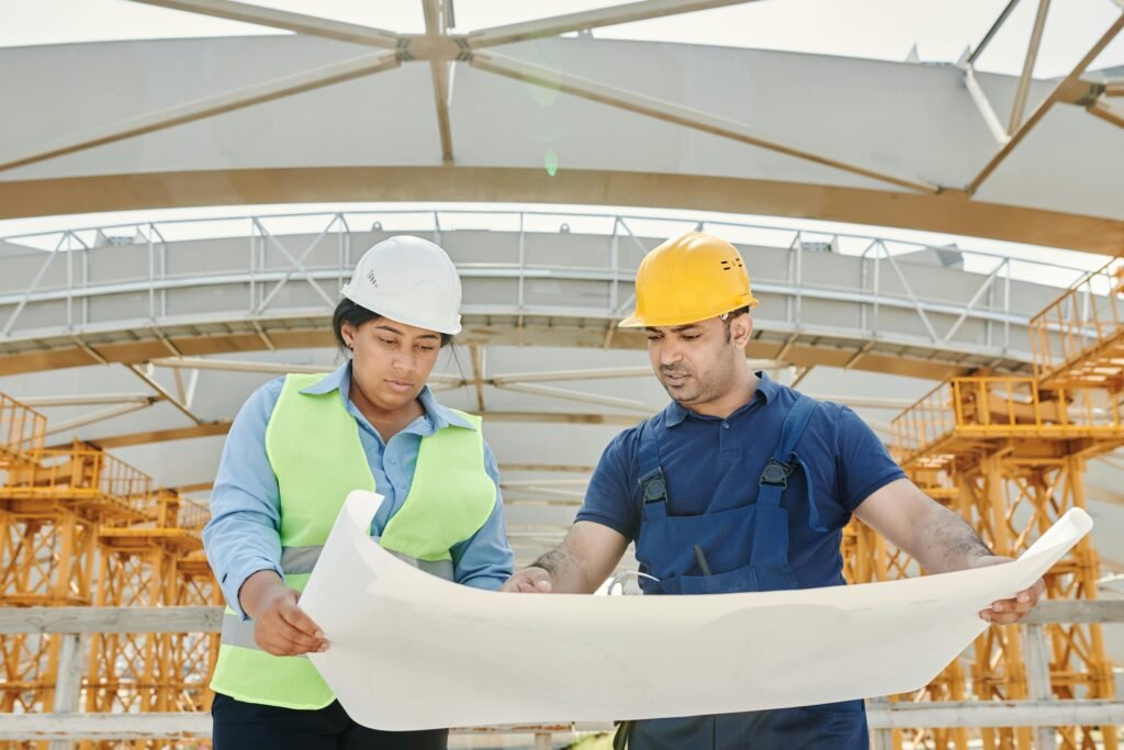 engineer discussing the construction site with map